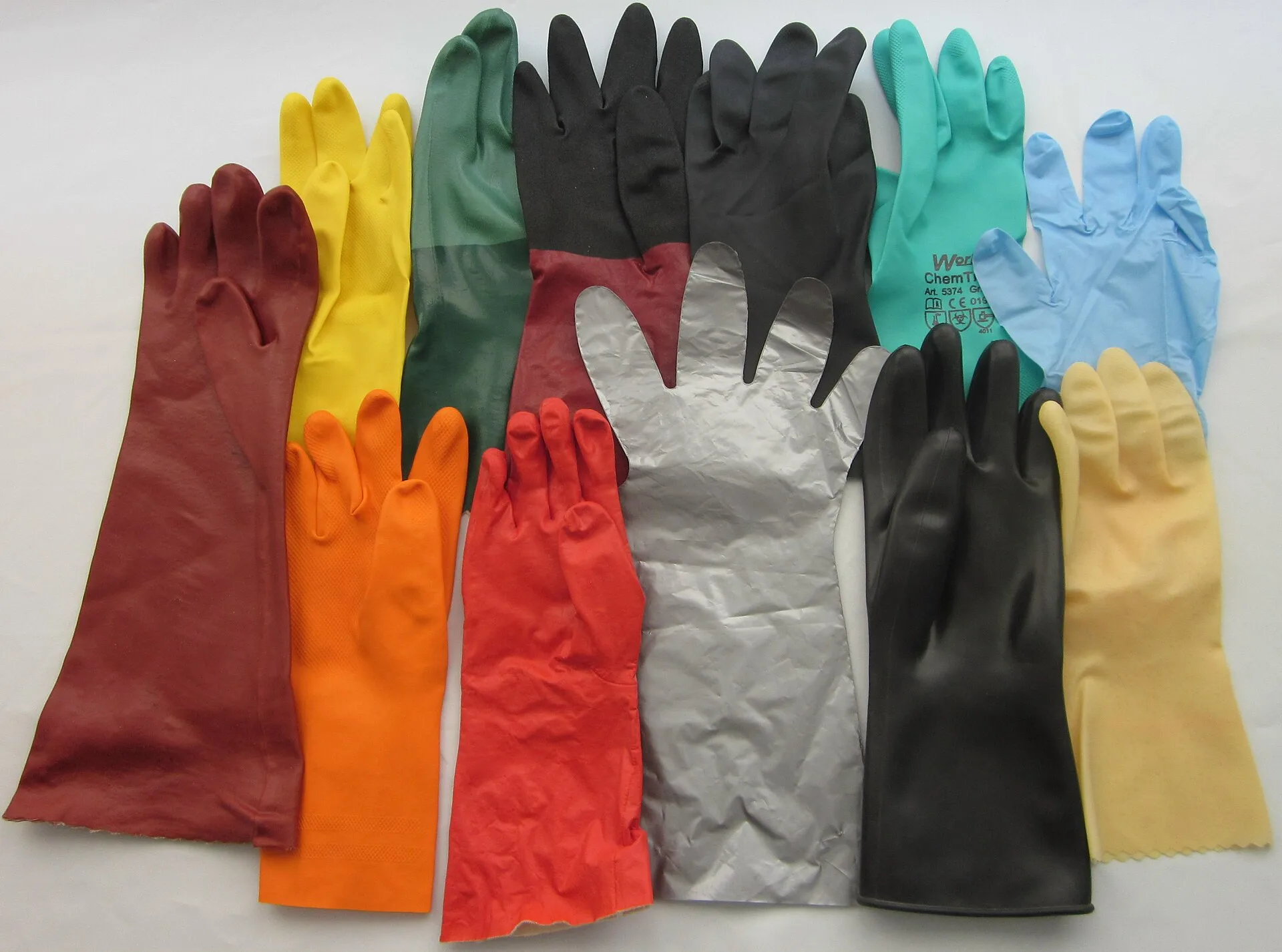 Assortment of chemical-resistant gauntlet gloves in latex, nitrile, neoprene and other materials