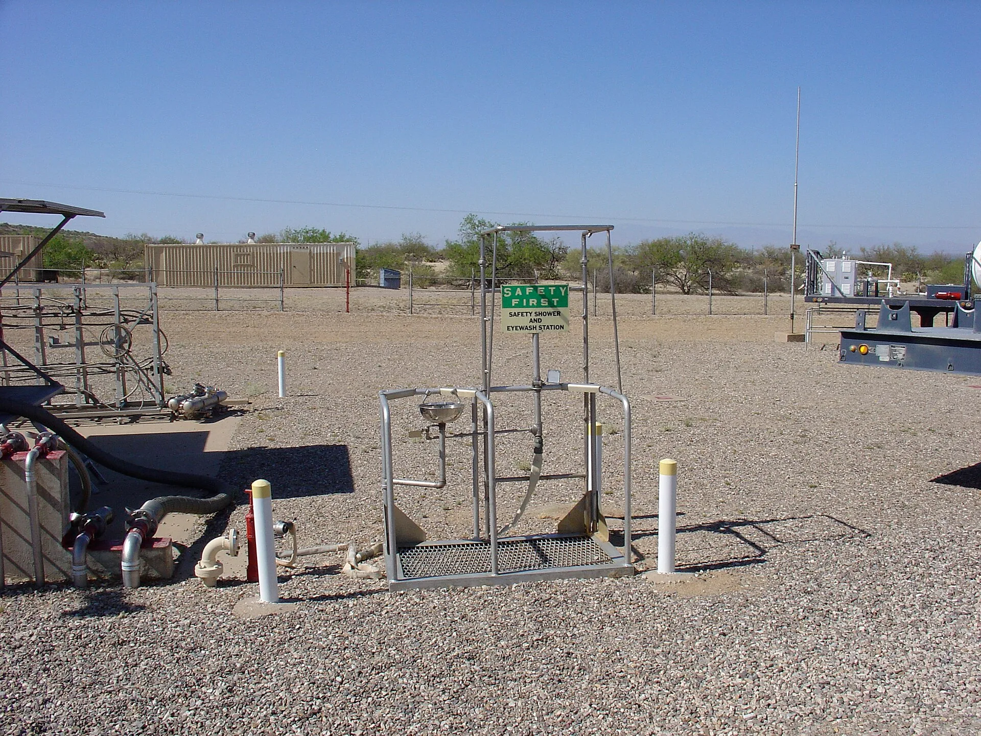 Free-standing outdoor emergency safety shower and eyewash station at an industrial site